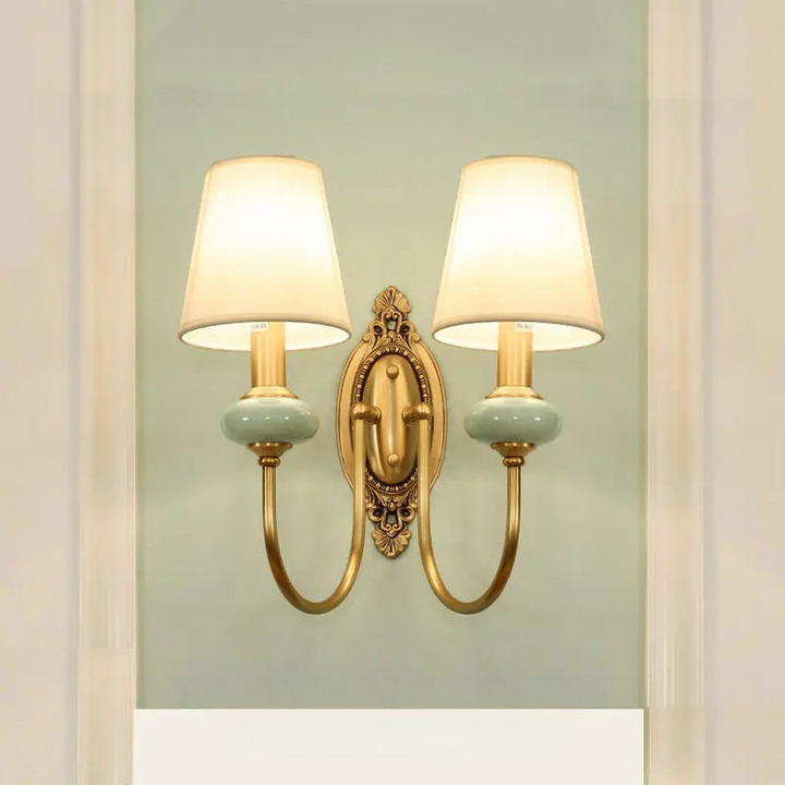 Elegant bedroom wall light with polished copper finish and warm glow