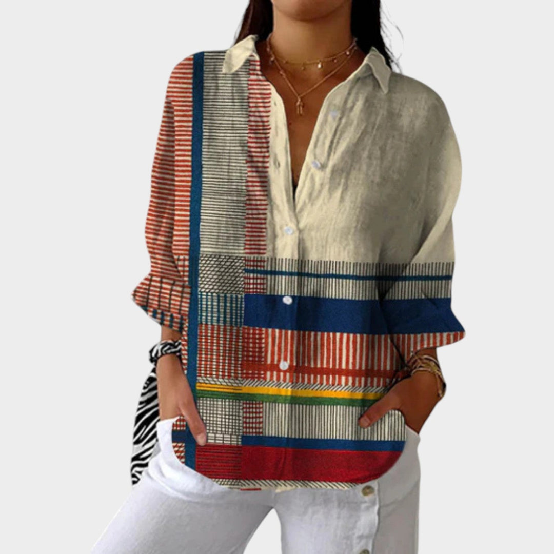 Woman wearing a vibrant red patchwork button-up long sleeve shirt