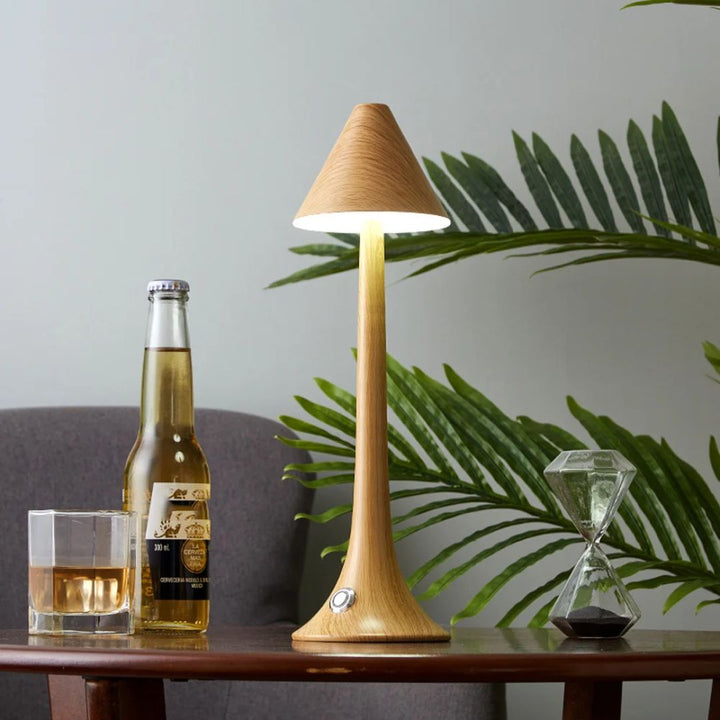 Portable cordless mushroom lamp casting a soft glow in a cozy living room setting