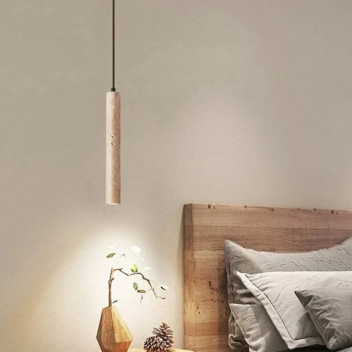Modern travertine hanging light fixture viewed from a low angle