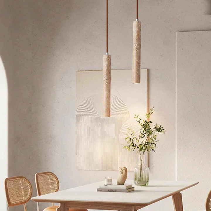 Elegant minimalist chandelier casting warm light in a luxury interior