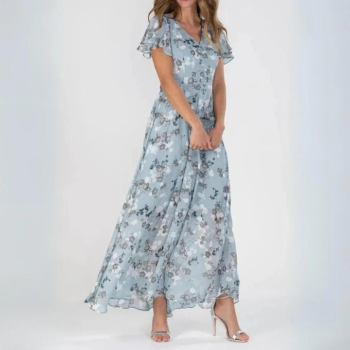 Full view of blue floral ruffle sleeve maxi dress on a model against a white background