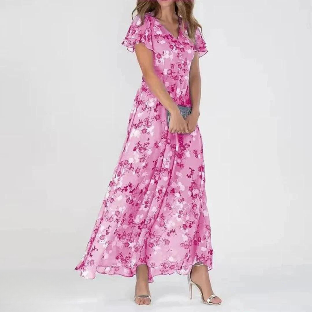 Full view of pink floral ruffle sleeve maxi dress on a model against a white background
