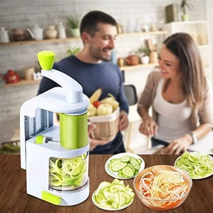 People preparing healthy meals using the vegetable slicer in a kitchen