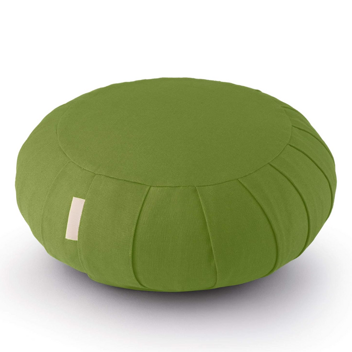 Breathwork accessory and floor pillow styled in serene living room setting