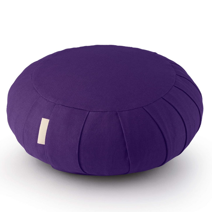 Stack of buckwheat hull meditation pillows showing neutral zen decor tones