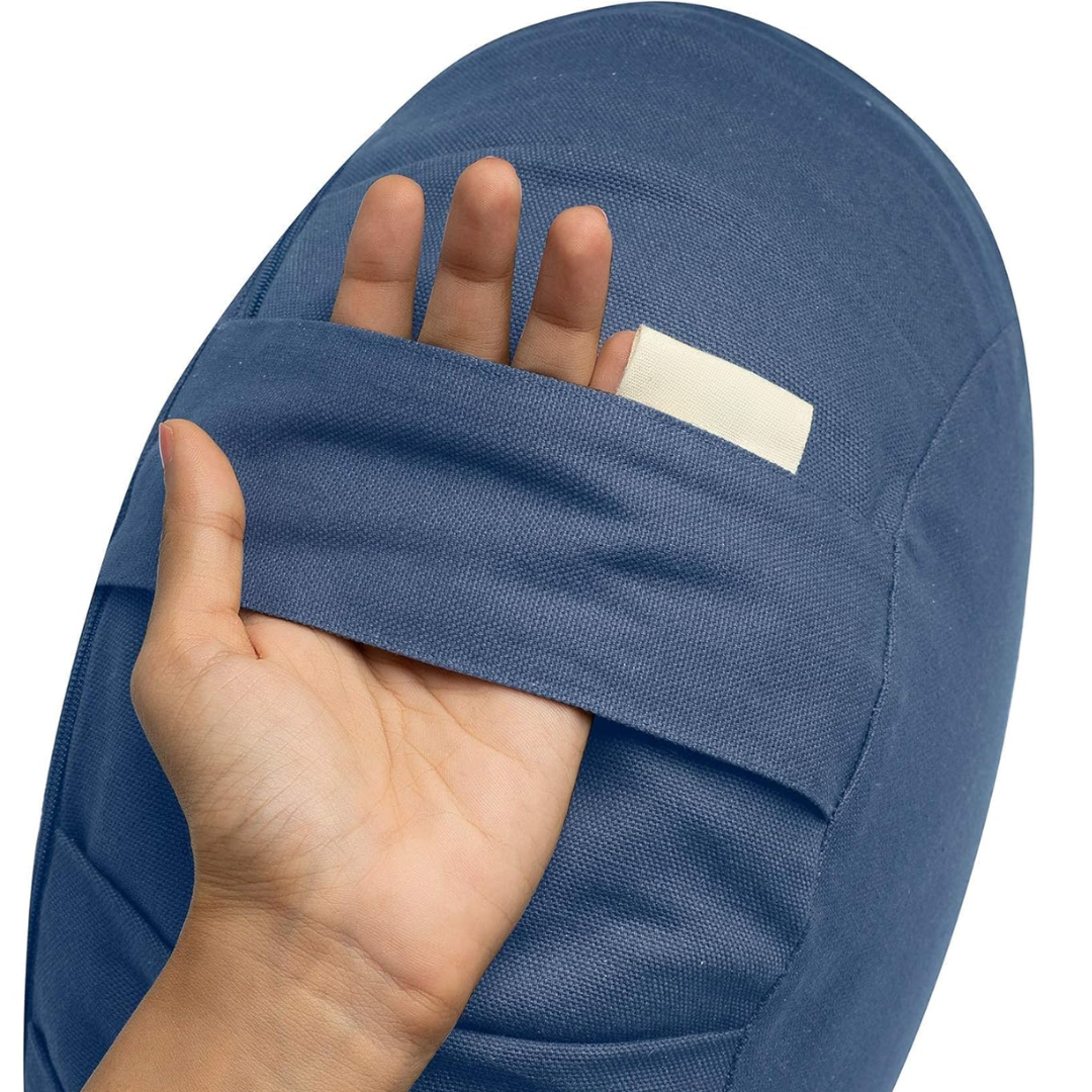 Close-up of a blue ZenRest meditation cushion showing the built-in carry handle and fabric texture