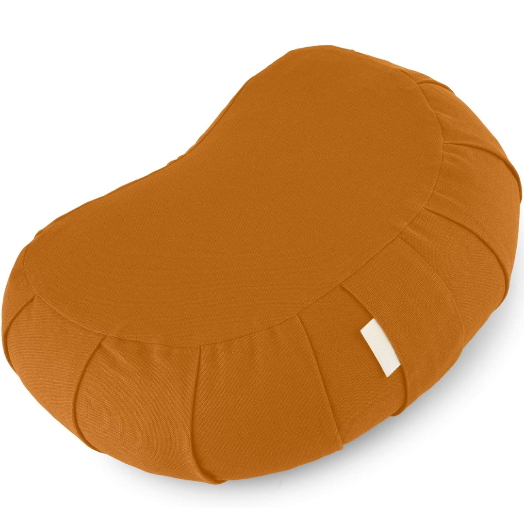 Person sitting comfortably on buckwheat meditation cushion for mindful yoga posture