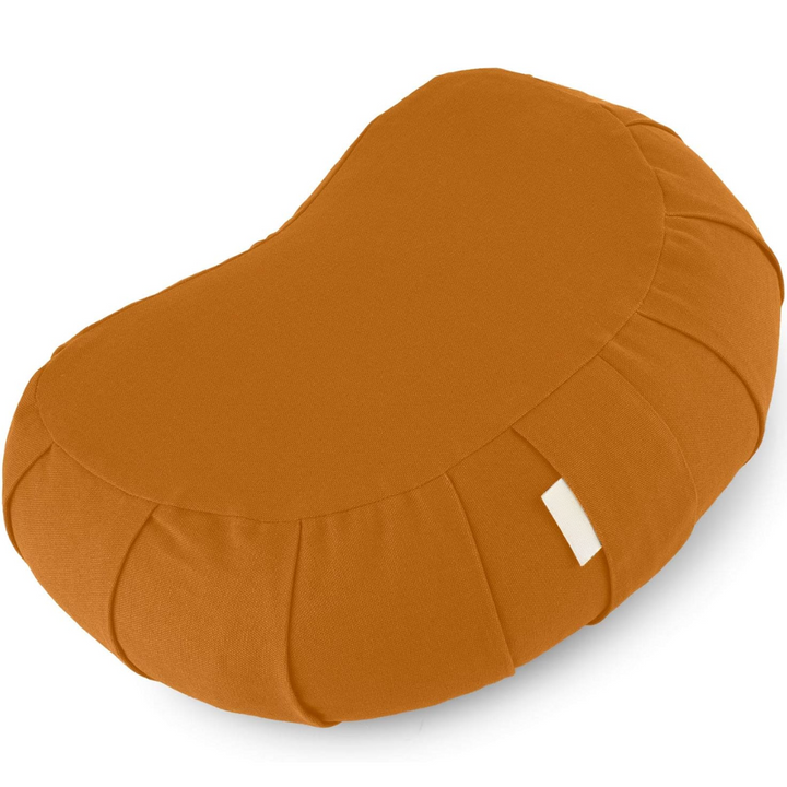 Person sitting comfortably on buckwheat meditation cushion for mindful yoga posture