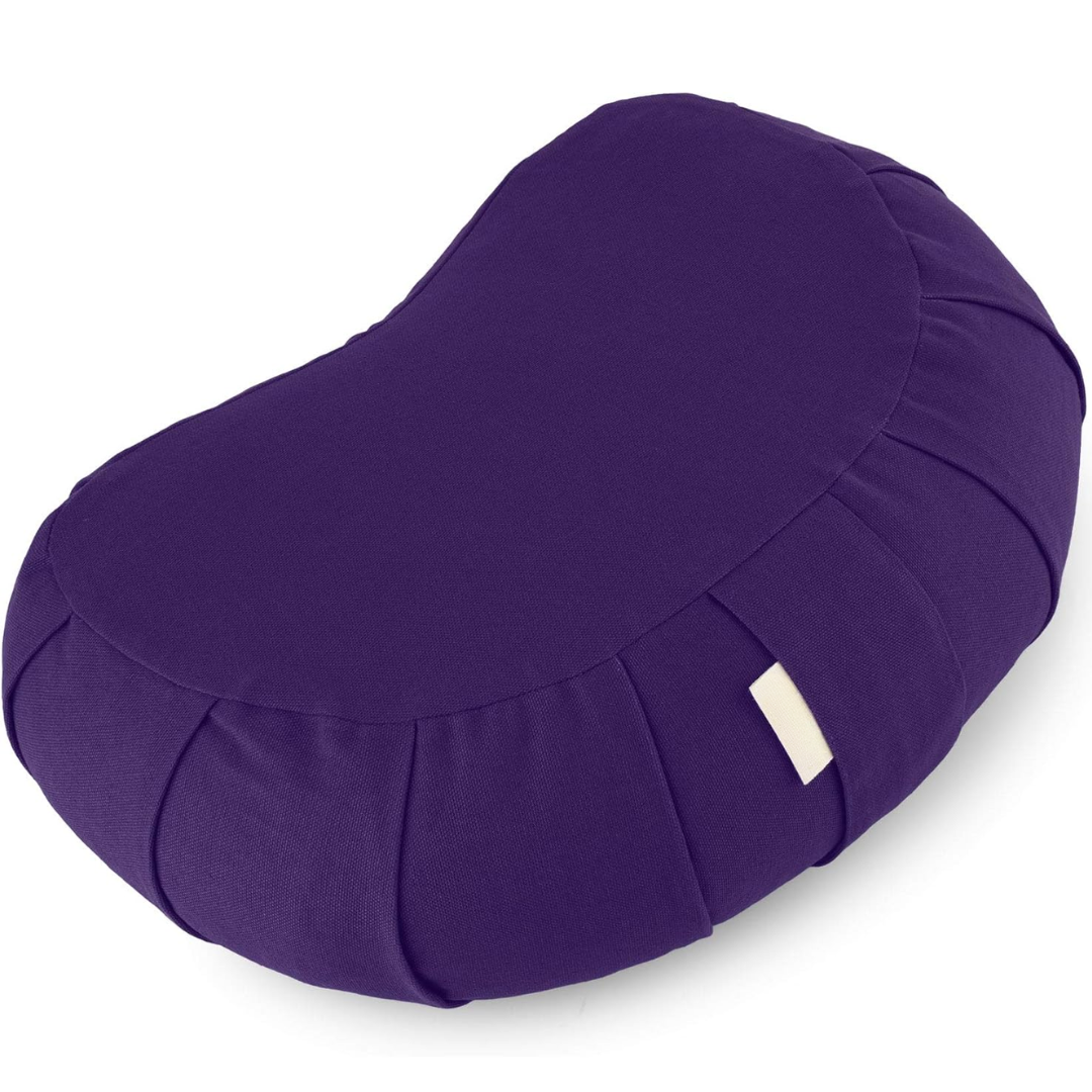 Ergonomic curved meditation cushion paired with a yoga mat for daily practice