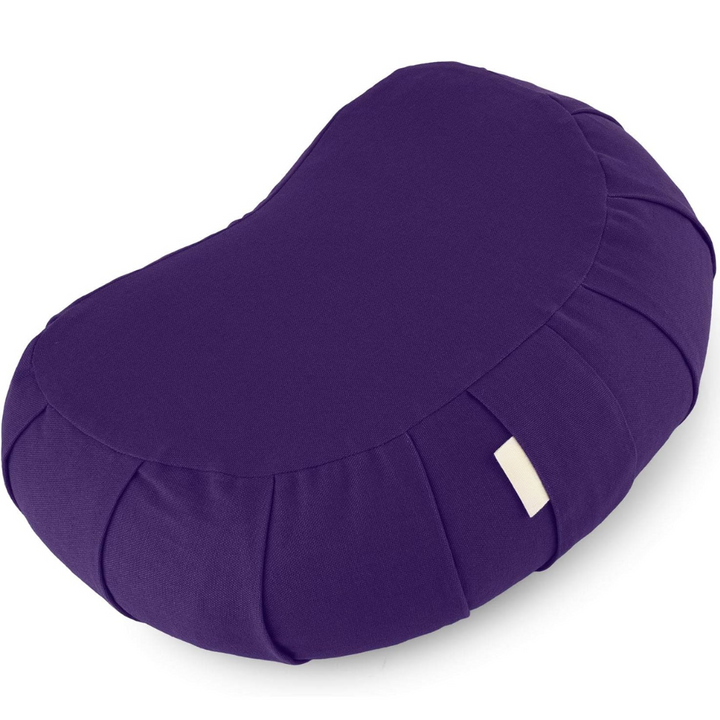 Ergonomic curved meditation cushion paired with a yoga mat for daily practice