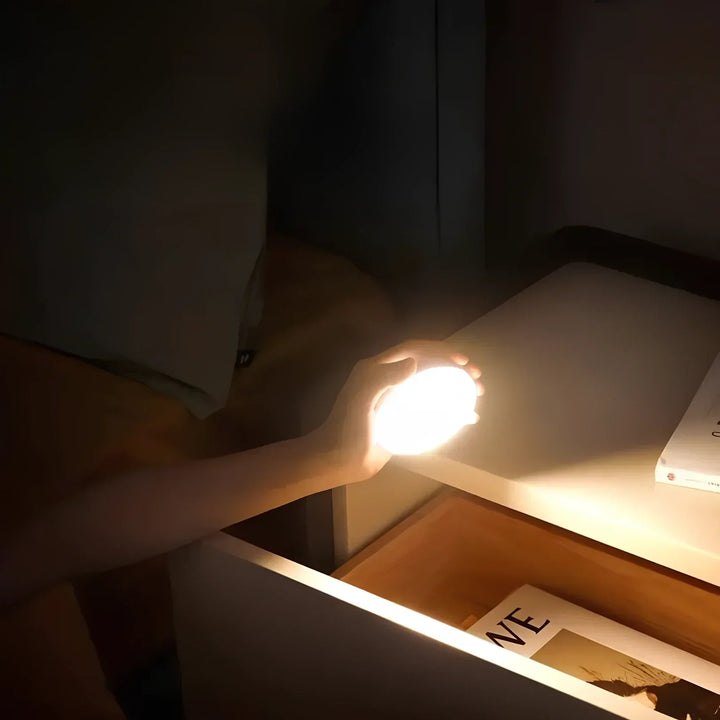 Magnetic mount installation of a motion sensor LED light on a wall