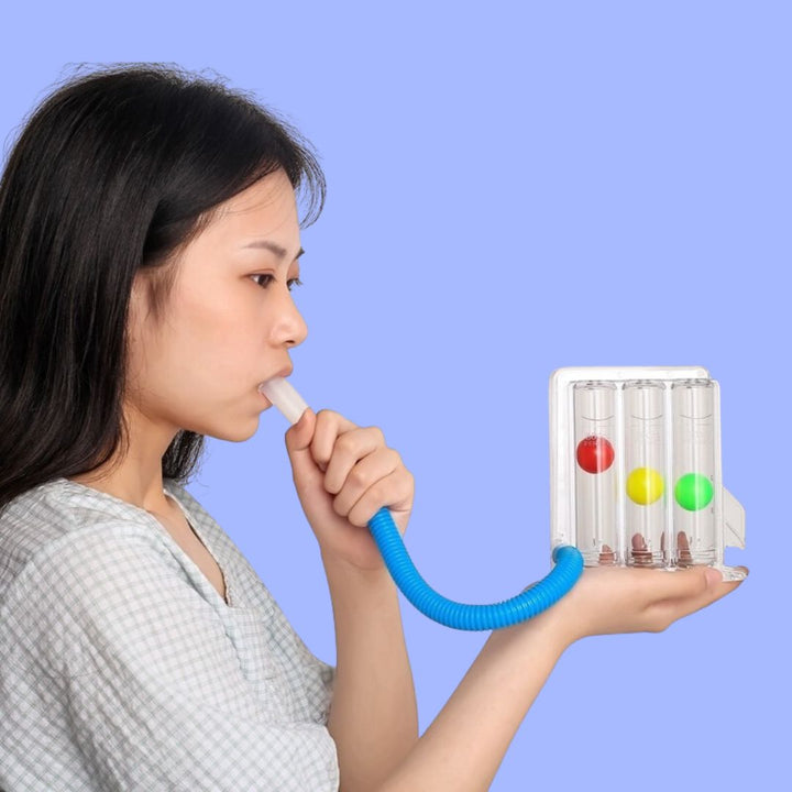Side view of woman holding the TriFlo breathing exerciser