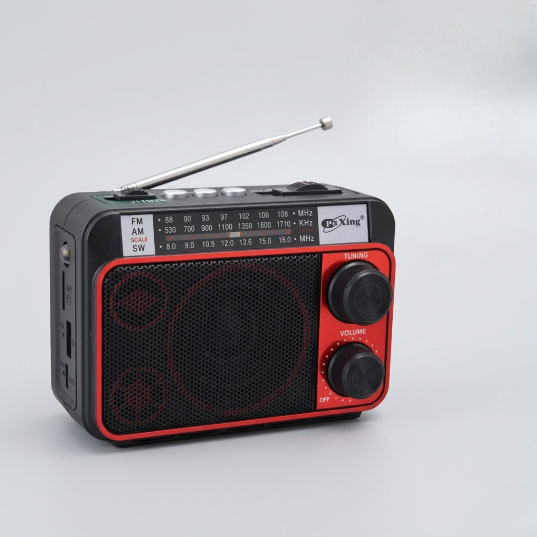 Silver and black compact radio held in hand for size comparison