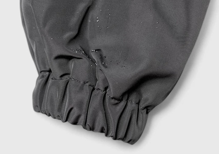 Full length view of womens oversized hooded raincoat styled for casual wear