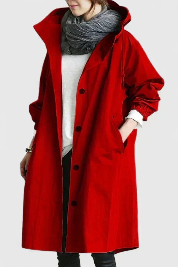 Side profile of womens oversized hooded raincoat and windbreaker jacket