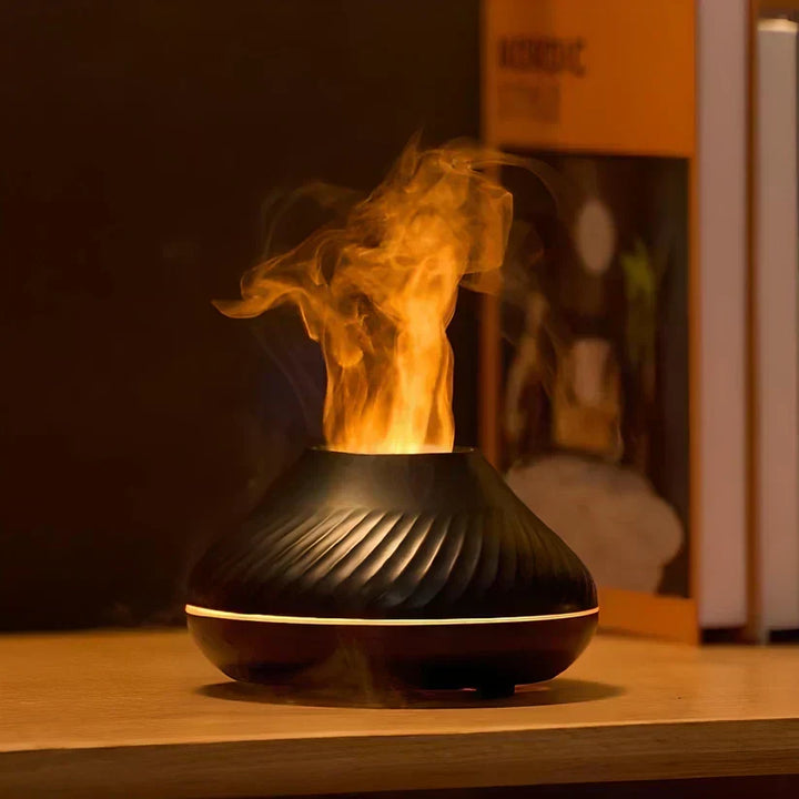 Black LumoMist aroma diffuser glowing with a realistic flame effect