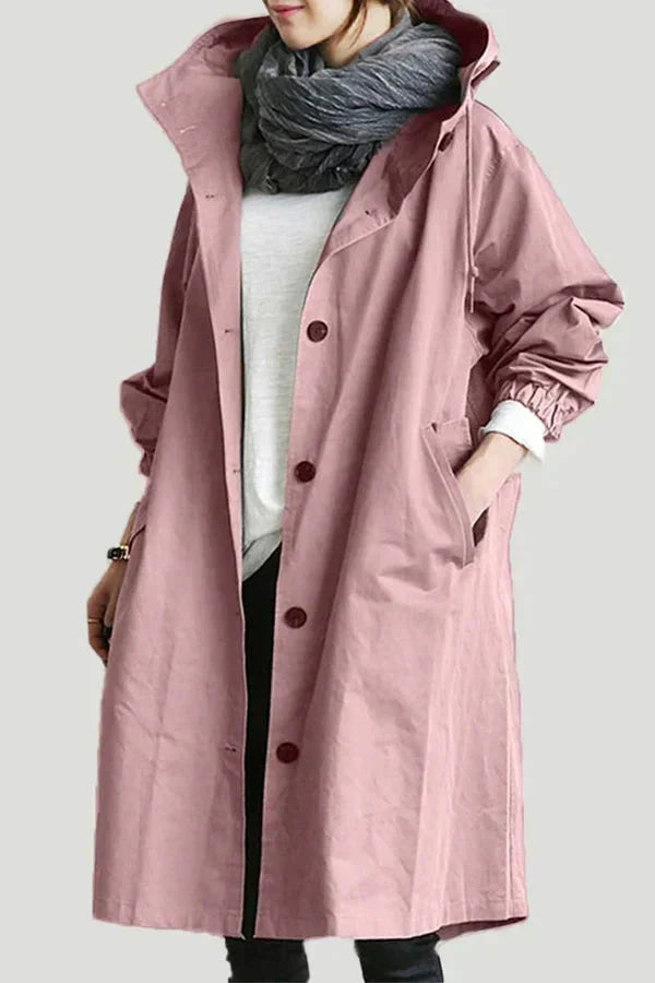 Detail of deep hood and drawstring on women's rain jacket