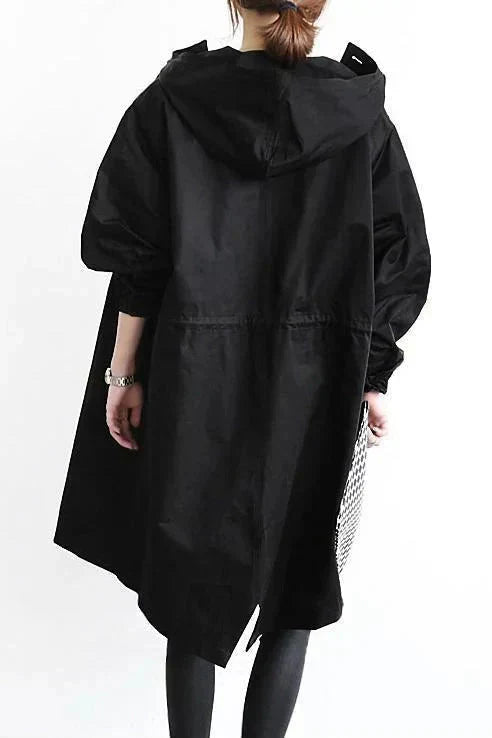 Model wearing women's hooded coat for rainy weather fashion