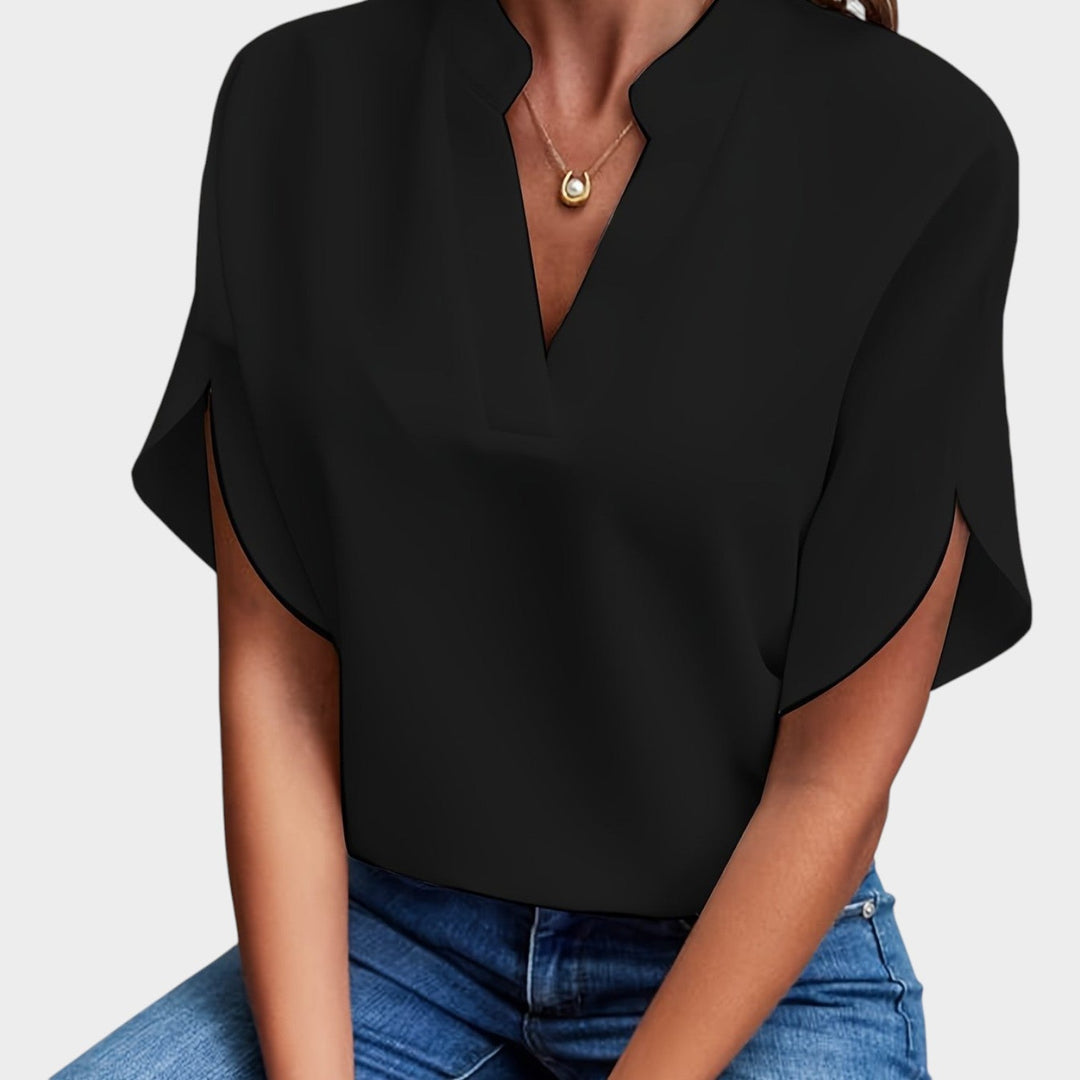 Close-up of black V-neck collared blouse for women