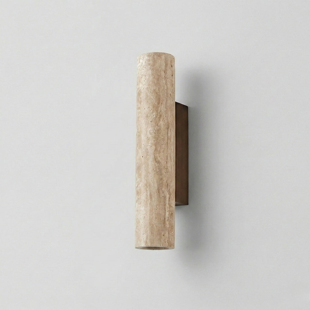 Close-up view of the beige travertine cylinder wall fixture