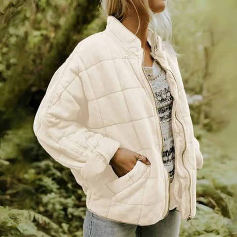 Folded view of women's casual winter jacket showcasing puffy texture