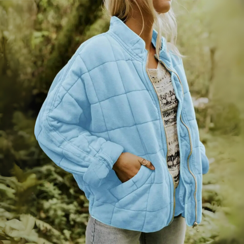 Close-up of quilted pattern and fabric texture on a warm winter coat