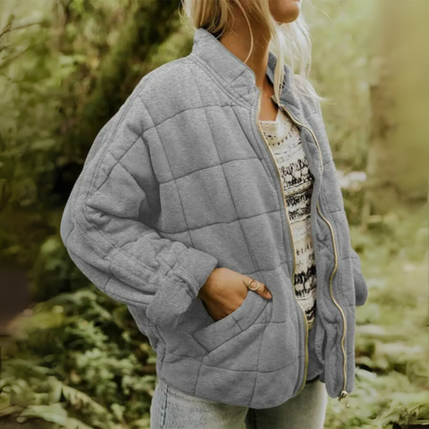 Side profile of women's quilted winter jacket for layering