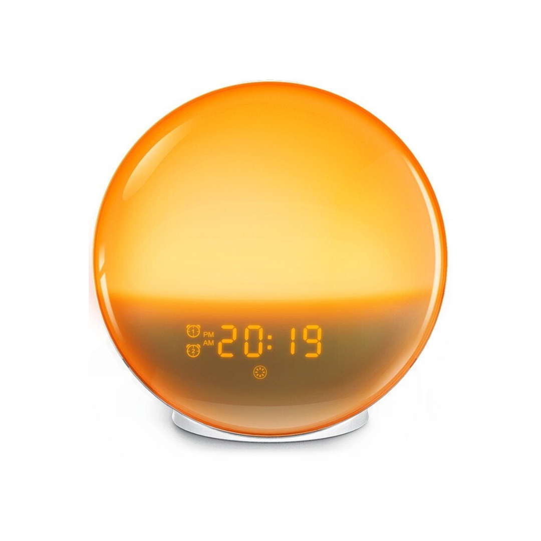 Round sunrise alarm clock with glowing orange light and digital time display