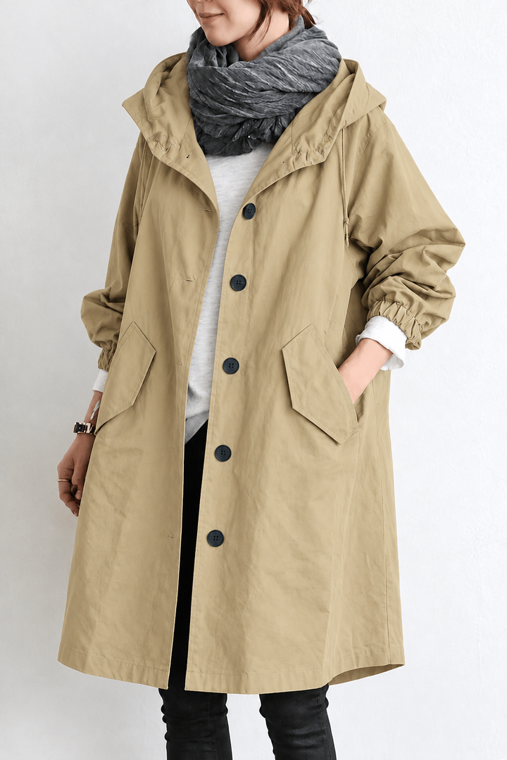 Womens waterproof hooded rain trench coat shown from the back, featuring a tailored silhouette.