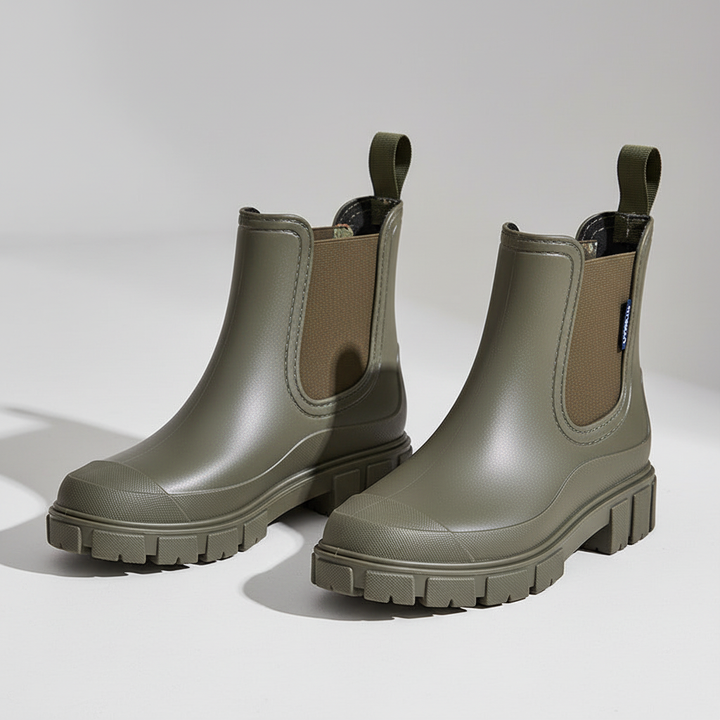 Assortment of women's waterproof rain boots in black, beige, and pink colors
