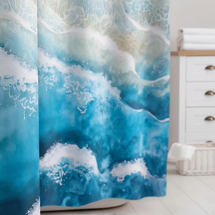 Detailed texture view of the blue and sandy coastal gradient on the waterproof shower curtain