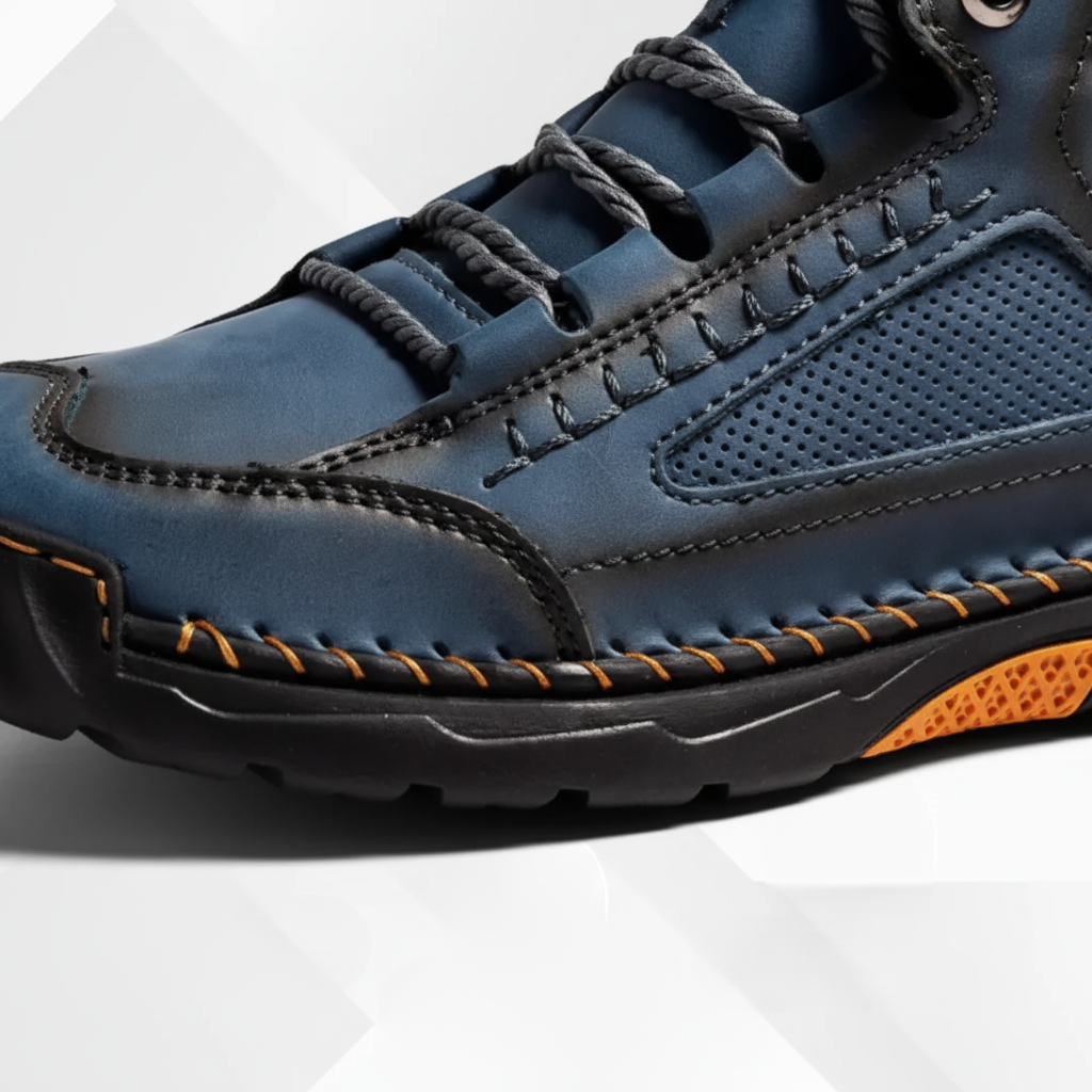 Close-up of the textured upper and stitching on blue men's ankle boots