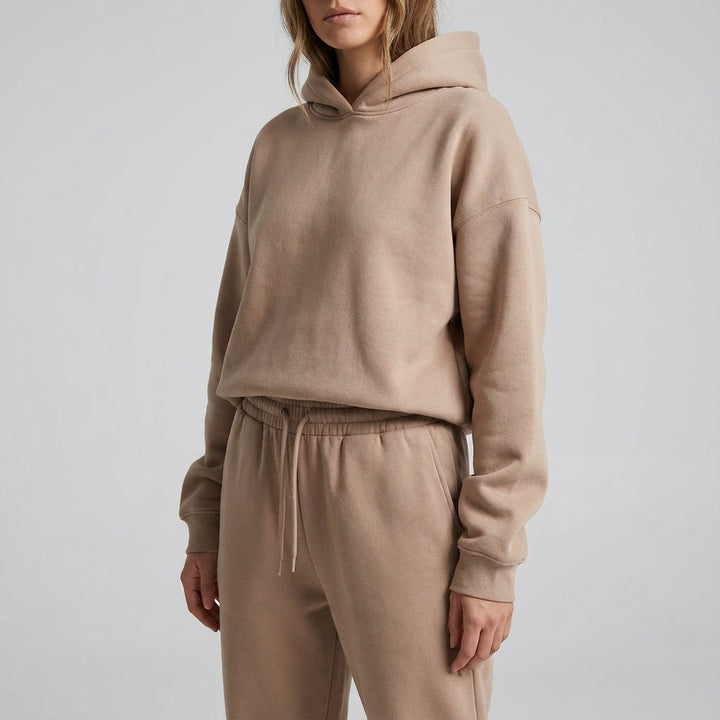 Close-up of the khaki hooded sweatshirt and matching trousers with drawstring