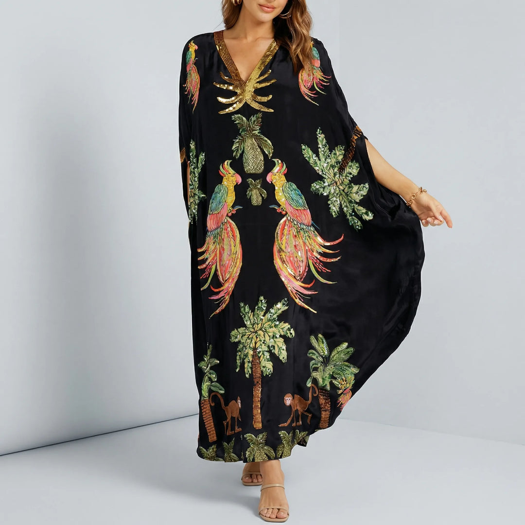 Studio shot of black embroidered tropical print kaftan dress