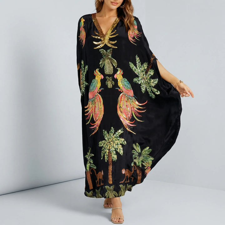 Studio shot of black embroidered tropical print kaftan dress