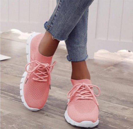 Women's pink lightweight knit lace-up sneakers closeup view