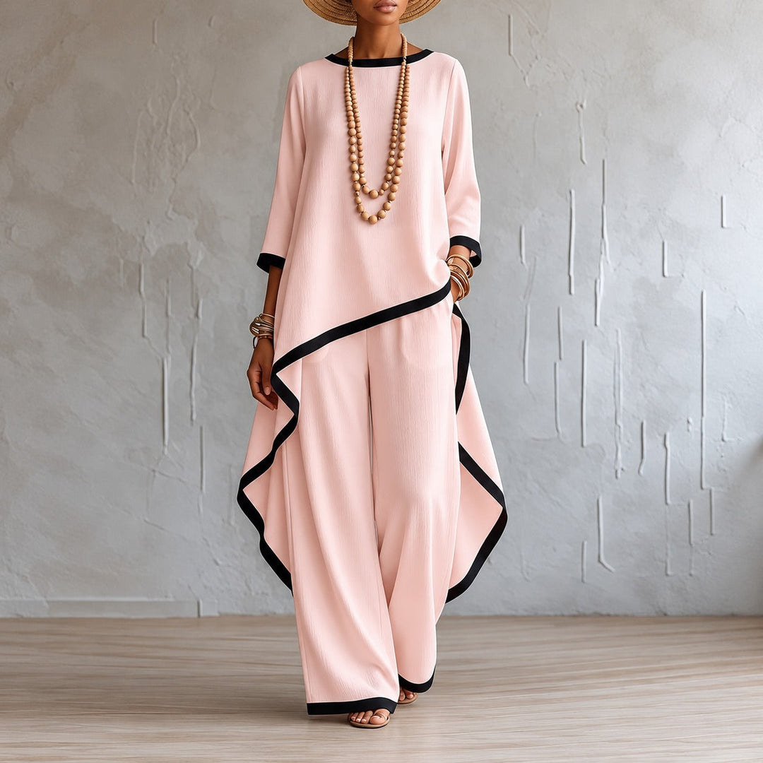Side angle of casual chic two piece outfit featuring asymmetric top and trousers