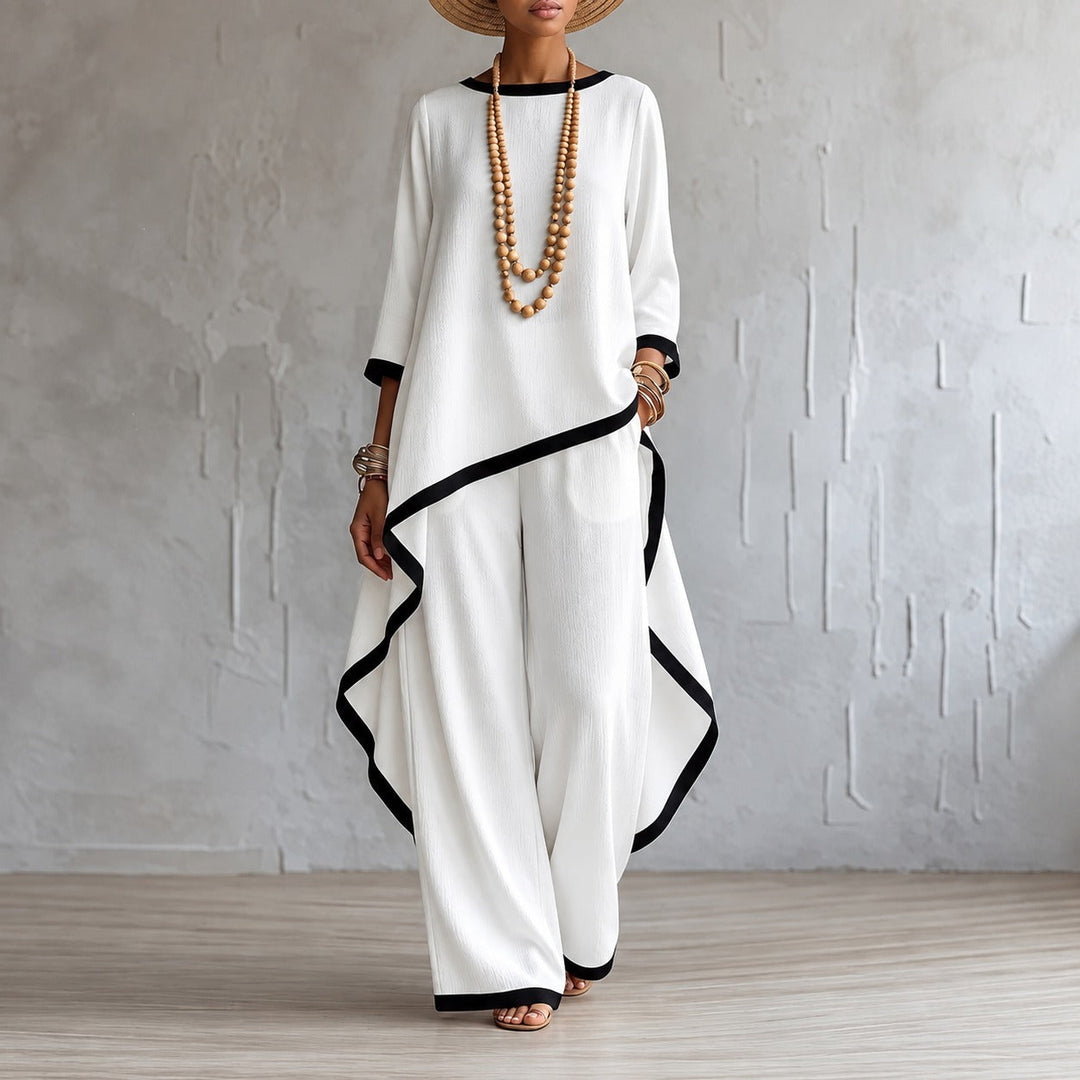 Women's asymmetric hem top and wide-leg trousers matching set in studio view
