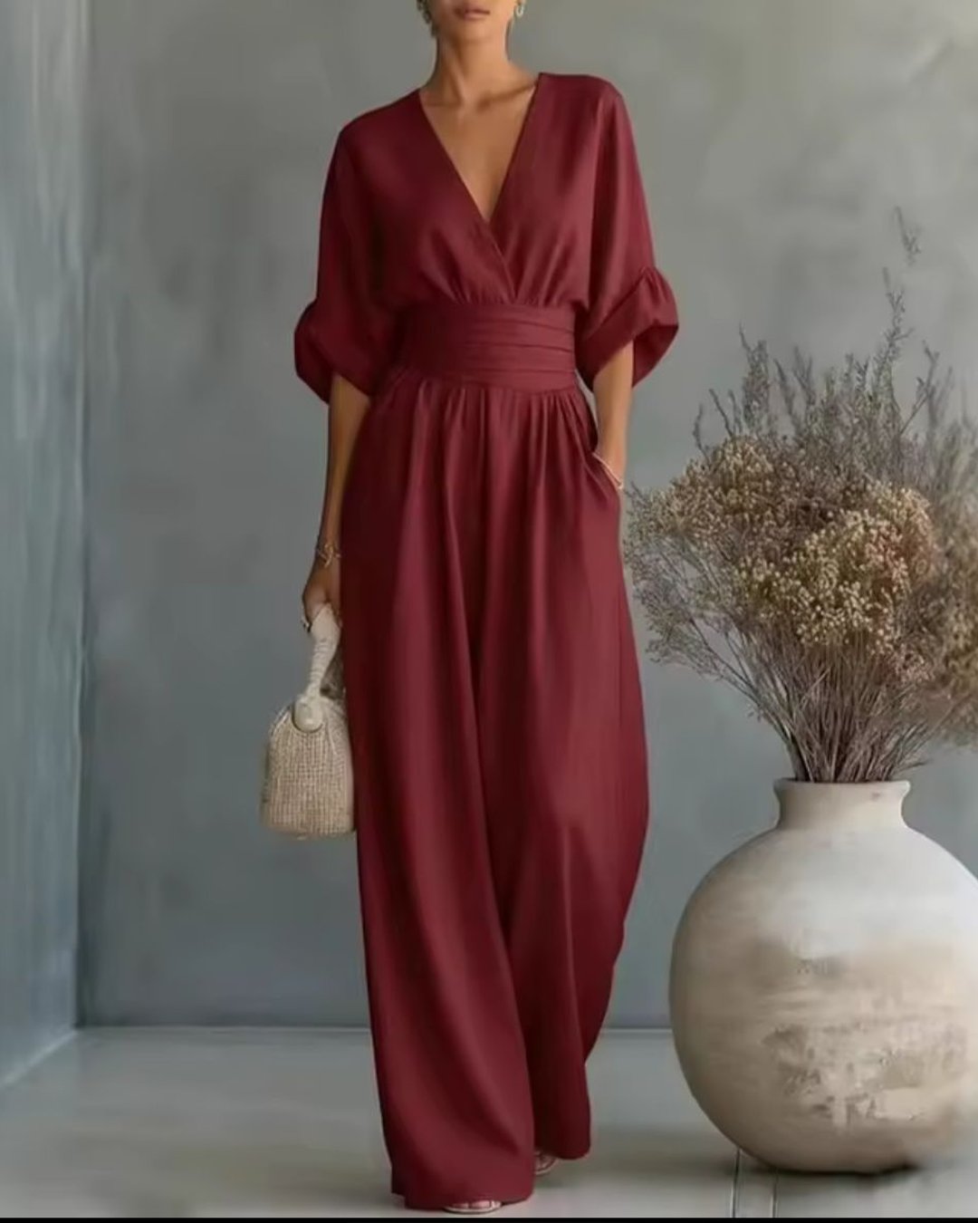 Side view of the stylish women's fashion long sleeve jumpsuit with V-neckline