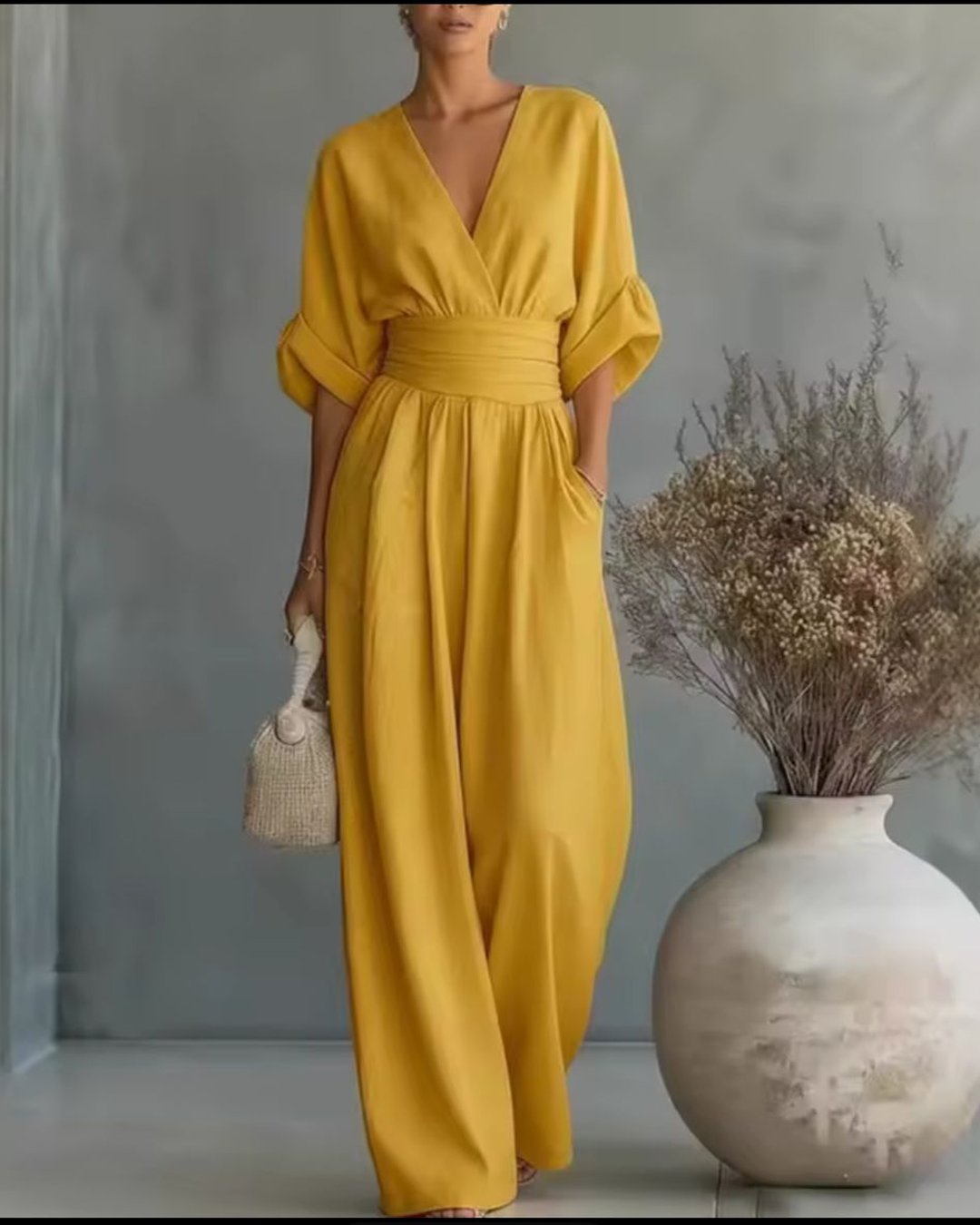 Back view showing the flattering tailored fit of this elegant women's jumpsuit