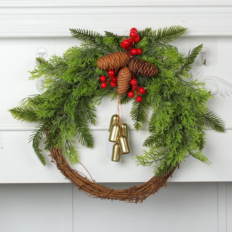 Rustic Christmas wreath with pine cones and golden bells displayed on a mantelpiece