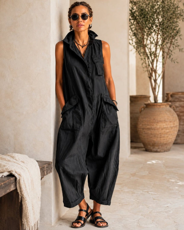 Black sleeveless utility jumpsuit for women, front view showing button-up design