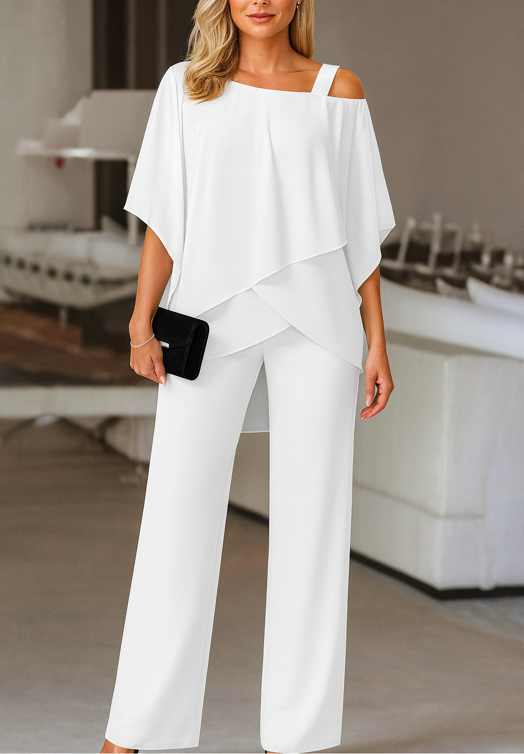 Model wearing a crisp white elegant evening pant set for formal events