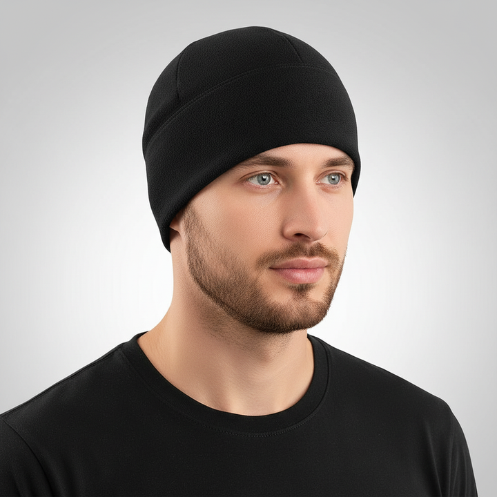 Studio shot of a man wearing a classic black winter fleece beanie