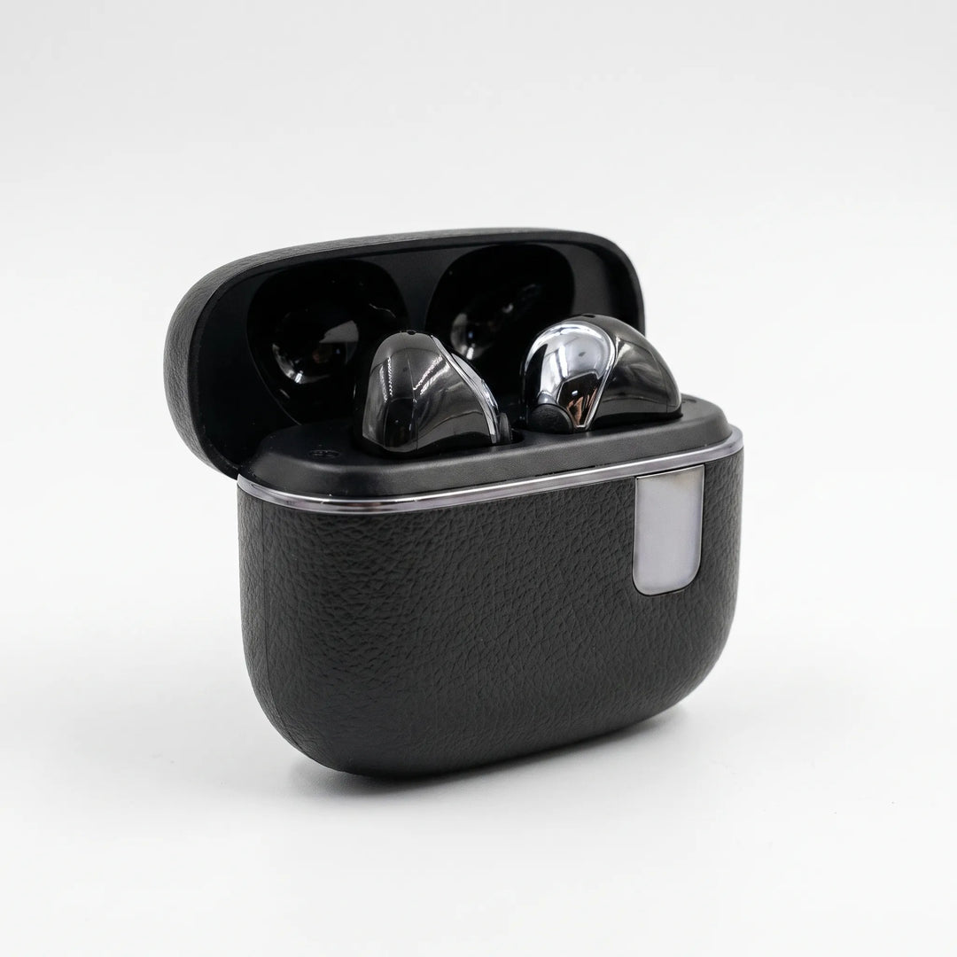 Closed black charging case for wireless earbuds on neutral background