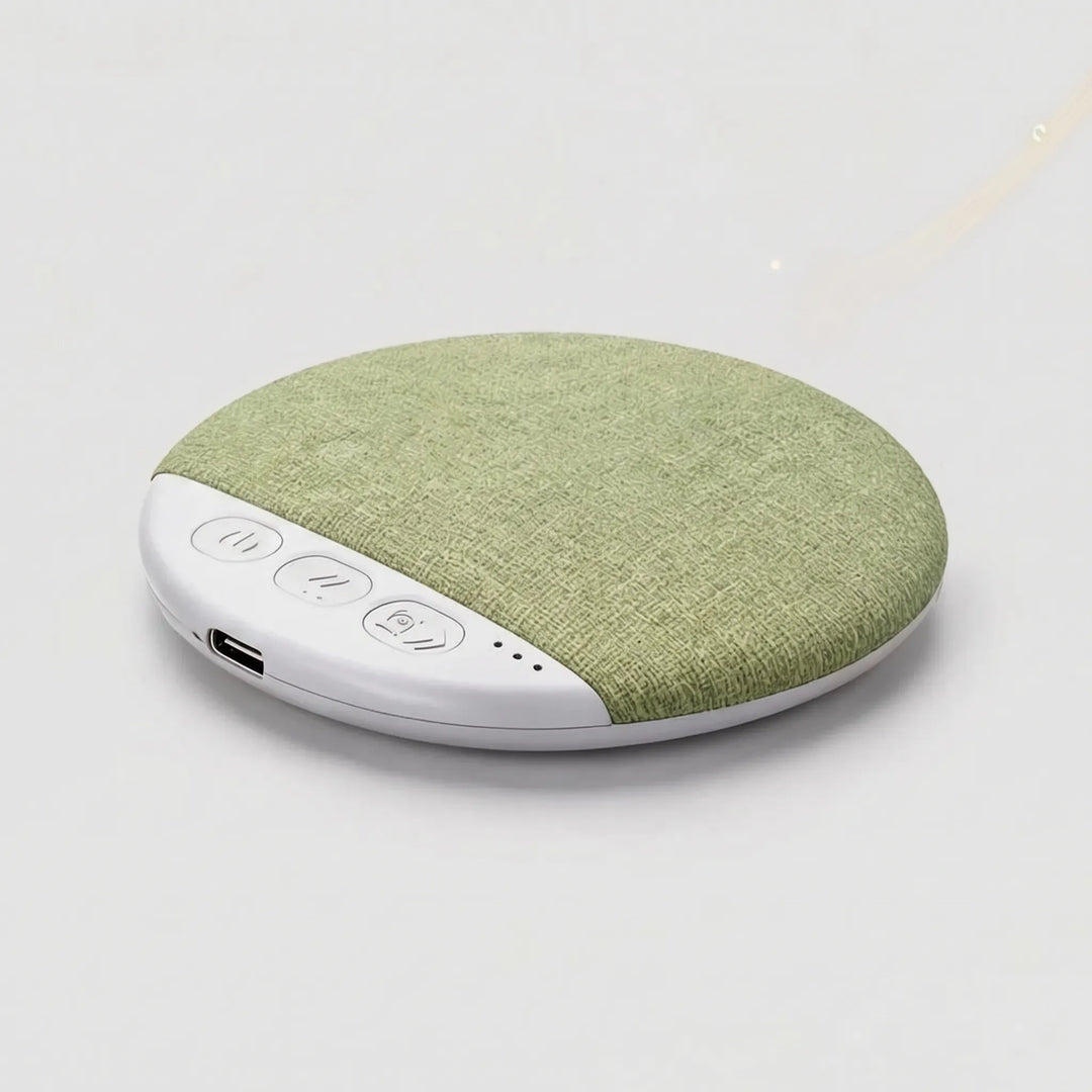 Bluetooth sleep gadget speaker resting on a clean white bed pillow