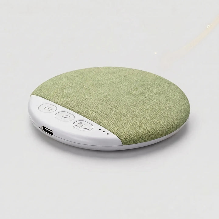 Bluetooth sleep gadget speaker resting on a clean white bed pillow