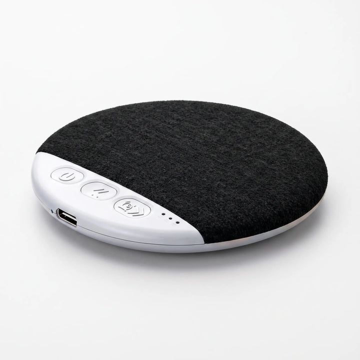 Close-up angled view of the black wireless pillow speaker showing control buttons