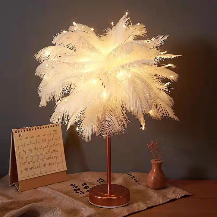Warm ambient bedside lighting glowing through delicate feathers on a decorative lamp